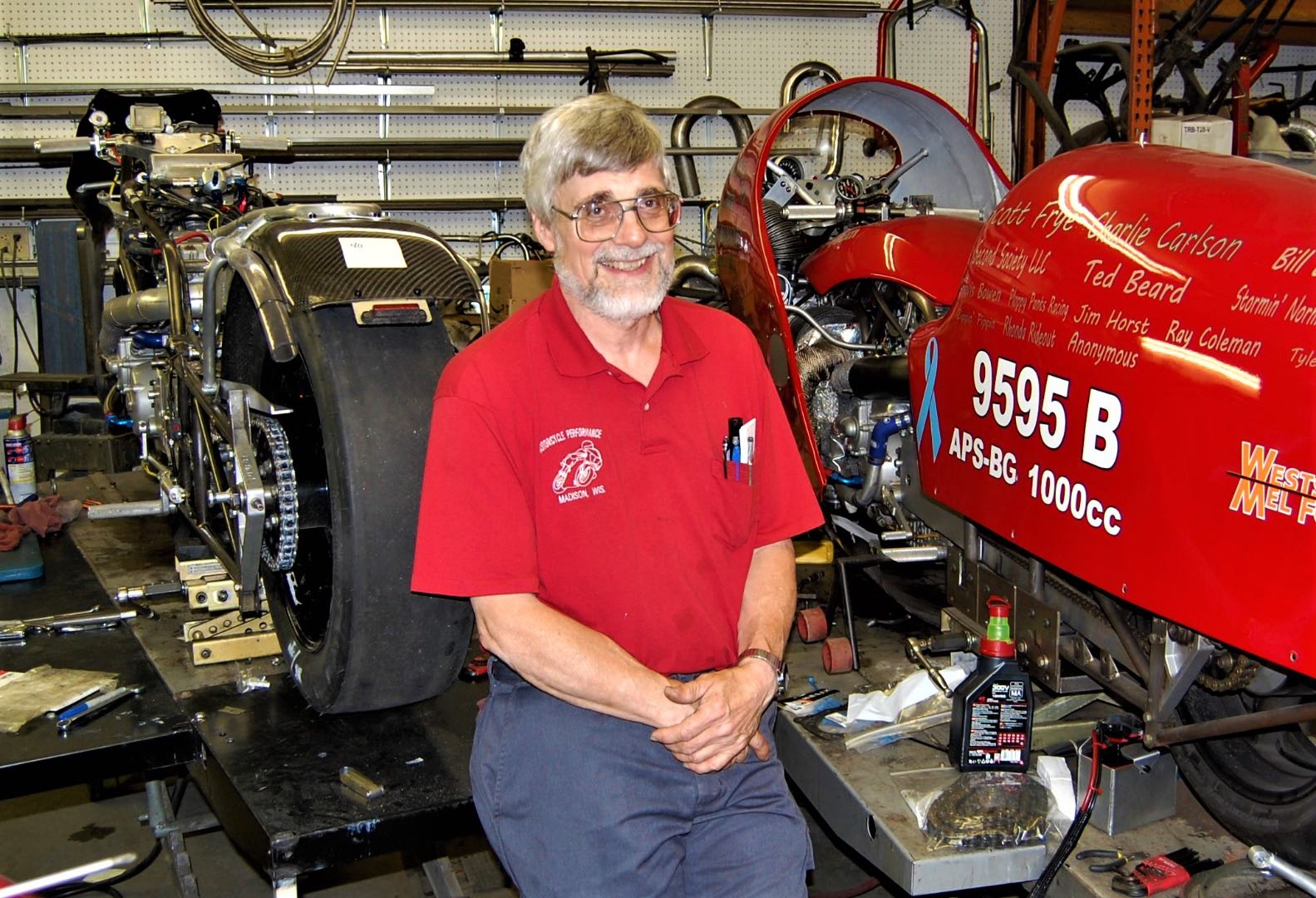 Bill Whisenant by two of the bikes he built